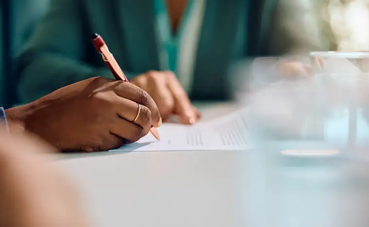 A business person signing contracts