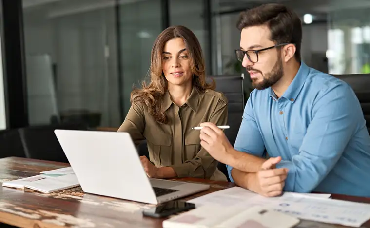 An agent going over the lease agreement with a landlord.