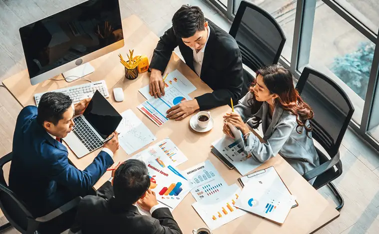 A group of business people having a meeting.