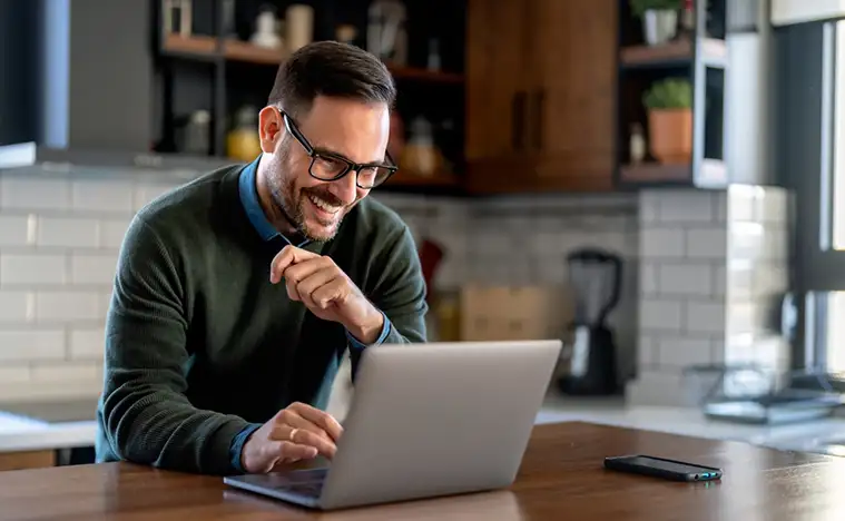 Business man working at home on his laptop.